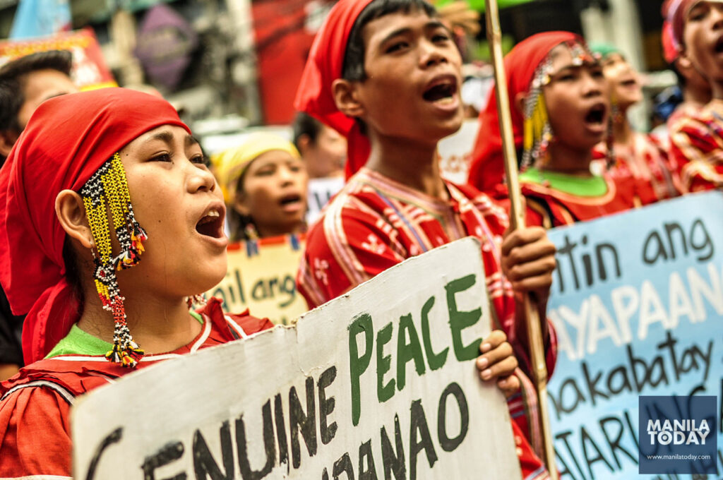 Some of the Grade 8 students of Salungpongan Ta' Tanu Igkanogon Community Learning Center in Talagaingod, Mindanao, calling for the pull out of military troops that have camped near their school. 
