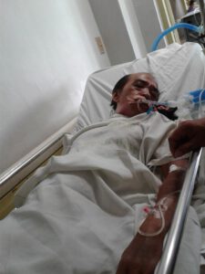 Bernabe Ocasla, 66, while comatose at the Jose Reyes Memorial Hospital. (Photo from Kilusang Magbubukid ng Pilipinas)