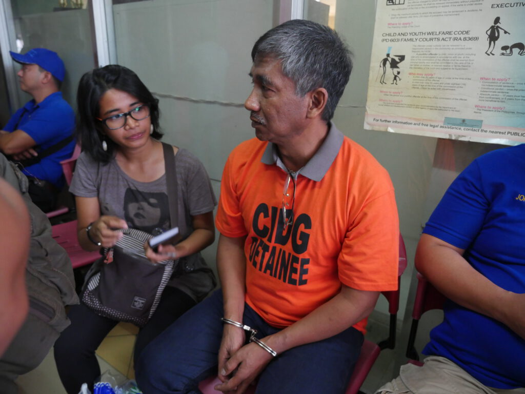 Ferdinand Castillo, 57, campaign officer of BAYAN Metro Manila who was arrested on February 12 and surfaced the next day, narrates to a paralegal the circumstances of his arrest. (Manila Today photo)