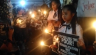 People who piad last respects to Kian joined in the candle-lighting and call for justice. Photo by Kathy Yamzon.