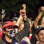 protestors-raising-their-fists-in-unity-2