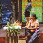 Filipina vendor selling goods for Chinese New year, in the oldest china town in the Philipines, and in the world copy